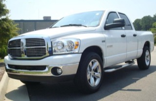 White pickup truck parked on pavement