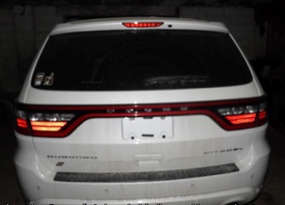 White SUV rear view, license plate obscured
