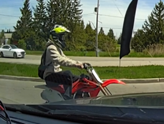 Person on a red dirt bike