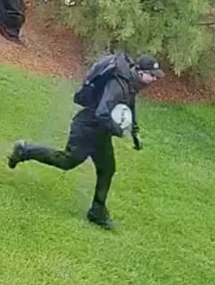 Person running with a snowball.