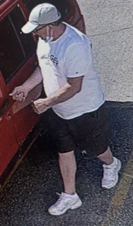 Person in white t-shirt and black shorts