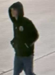 Person in a hooded sweatshirt and jeans