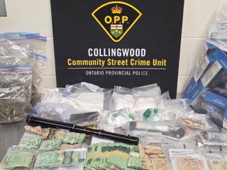 Bundles of Canadian currency and small baggies.