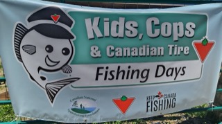 Cartoon fish with a police hat. Kids, Cops & Canadian Tire Fishing Days