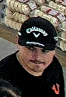 Man wearing a black Callaway cap