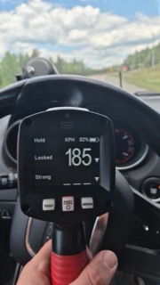 Speedometer reading 185 kilometers per hour, 82% battery