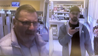 Two men in a store, one wearing sunglasses and a light jacket, the other wearing a hoodie and holding a phone.
