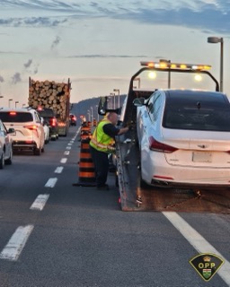 Towing truck loading a car.