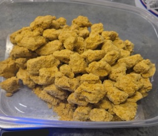 Pile of fluffy, golden-brown chicken nuggets