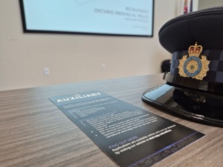 Ontario Provincial Police hat on a document