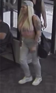 Person with blonde hair and athletic build wearing a tank top, leggings, and sneakers.