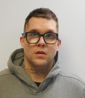 Man with short haircut and glasses